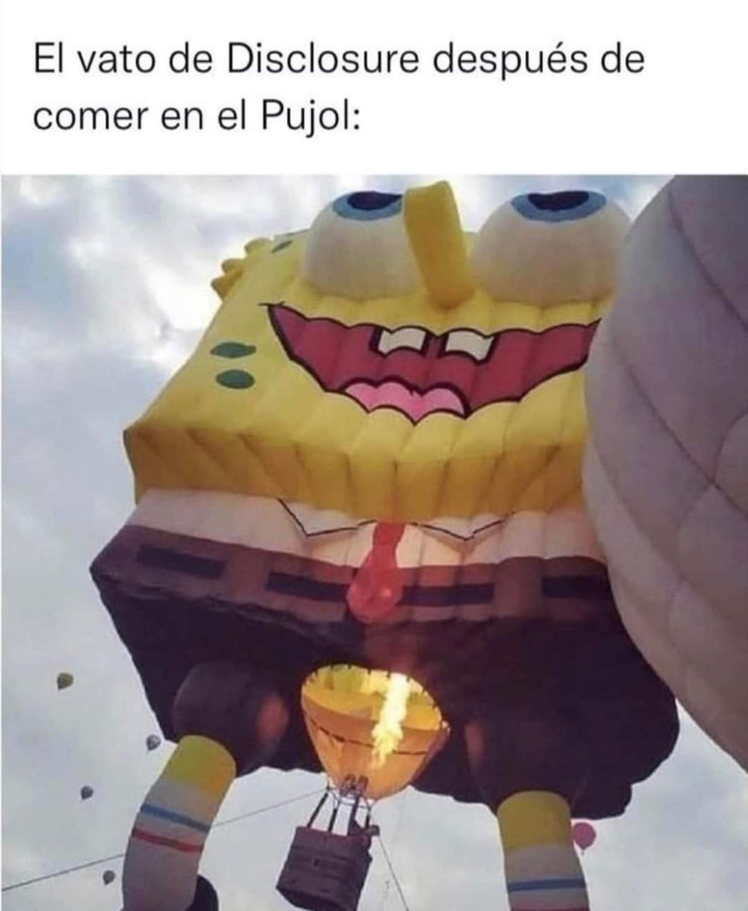 a person holding a balloon with a face on it